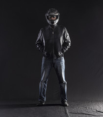 Poster - full-length biker on a black background