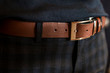 Brown leather men 's belt in trousers