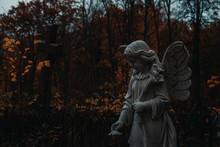 Angel Statues In A Grave Cemetery