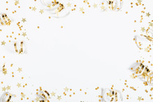 Christmas Modern Composition. Golden Decorations, Confetti, Streamers, Stars On White Background. Christmas, New Year, Winter Concept. Flat Lay, Top View, Copy Space