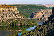 LANDSCAPE OF CLIFFS AND REFLECTIONS IN THE WATER OF THE DURATÓN RIVER IN SEGOVIA, SPAIN