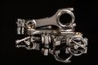 high performance racing motorcycle engine parts on a black reflective background