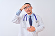 © Krakenimages.com - Young doctor man wearing stethoscope over isolated background Touching forehead for illness and fever, flu and cold, virus sick