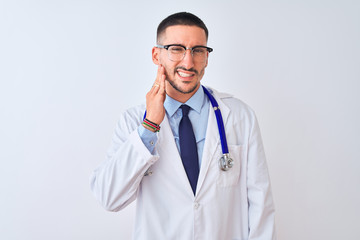 Sticker - Young doctor man wearing stethoscope over isolated background touching mouth with hand with painful expression because of toothache or dental illness on teeth. Dentist concept.