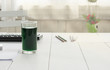 Chlorophyll in glass on table