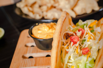 Close up Homemade Baja beef Tacos salad with tomato Salsa and Chips - mexican food