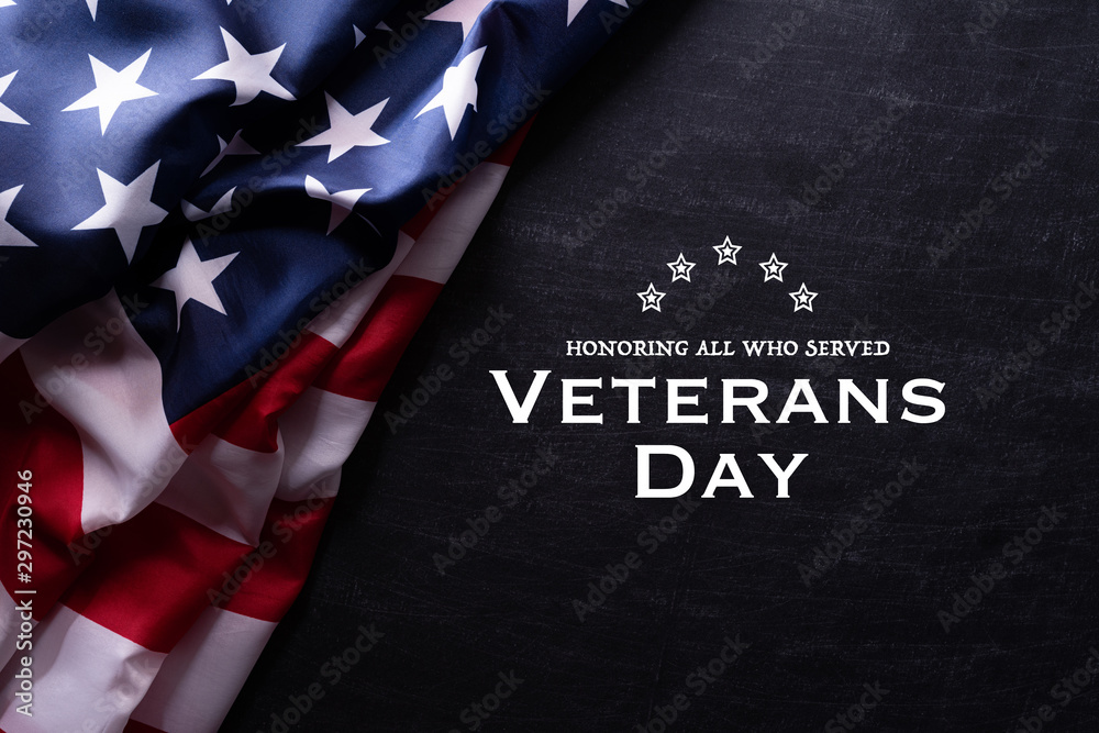 Happy Veterans Day. American flags with the text thank you veterans against a blackboard background. November 11. - obrazy, fototapety, plakaty 