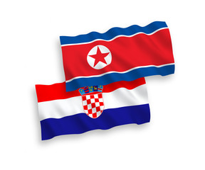 National vector fabric wave flags of North Korea and Croatia isolated on white background. 1 to 2 proportion.