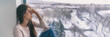 Leinwandbild Motiv Winter depression sad woman with Seasonal affective disorder girl grief stricken alone at home window thinking negative thoughts. Mental health banner panorama background.