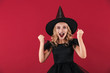 © Drobot Dean - Surprised little girl witch in carnival halloween costume