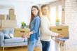 © Krakenimages.com - Young couple moving to a new home, smiling happy holding cardboard boxes at new apartment