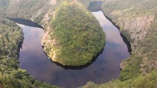 Aerial view of incredible Vyhlídka Máj. Calm, relaxing, horseshoe river meander. 
drone flying upwards. 