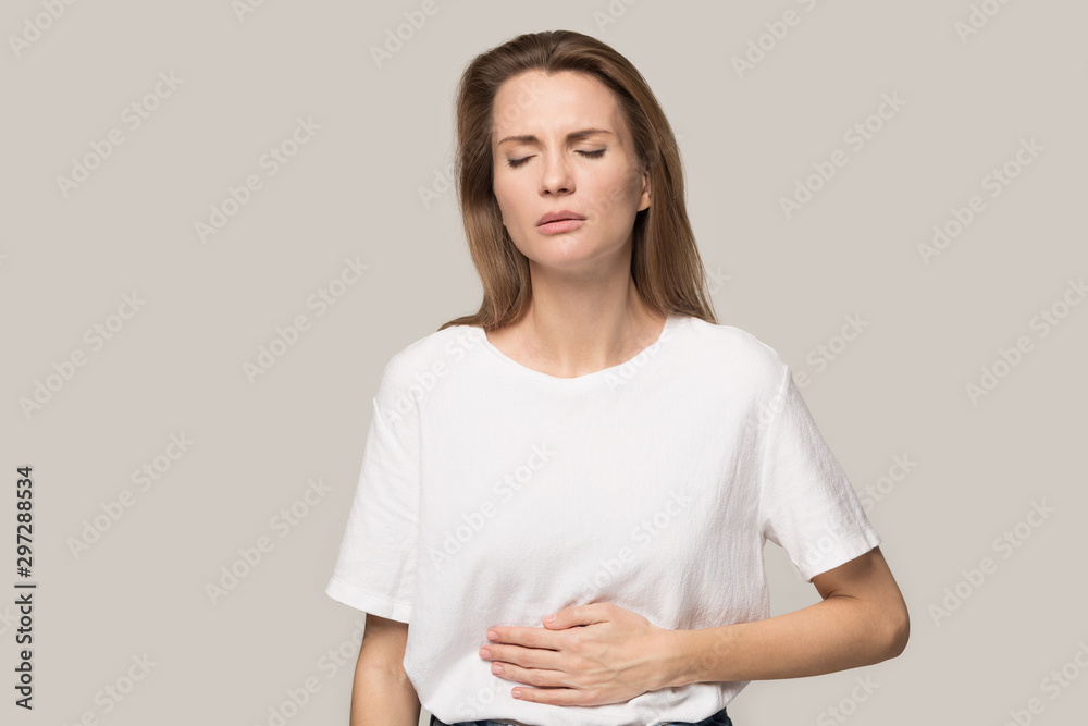 Sick young woman touch stomach suffer from indigestion - obrazy, fototapety, plakaty 