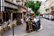 Cozy Street With Tables Of Cafe In Quarter Montmartre In Paris, France