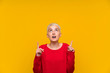 © luismolinero - Teenager girl with white short hair over yellow wall pointing with the index finger a great idea