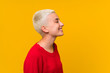 © luismolinero - Teenager girl with white short hair over yellow wall standing and looking to the side