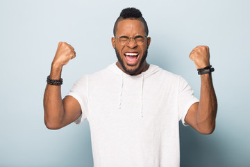 Wall Mural - Overjoyed biracial male feel euphoric celebrating success