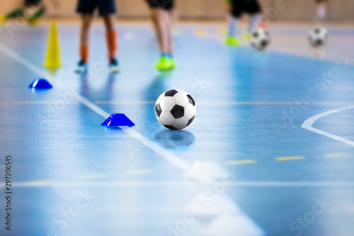 Futsal soccer training field. Young futsal players with balls on training. Cl...