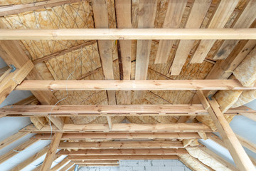 Wall Mural - House under construction with insulation glass wool on an attic floor