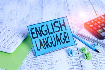 Poster - Text sign showing English Language. Business photo showcasing third spoken native lang in world after Chinese and Spanish Notepaper stand on buffer wire in between computer keyboard and math sheets