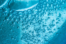 Abstract Colorful Background. Foam Of Soap With Bubbles Macro Shot. Closeup Bubbles In Water. Oil Drops On A Water Surface Abstract Background. Aqua Blue Bubbles. Blue Water And Soap Bubbles Wallpaper