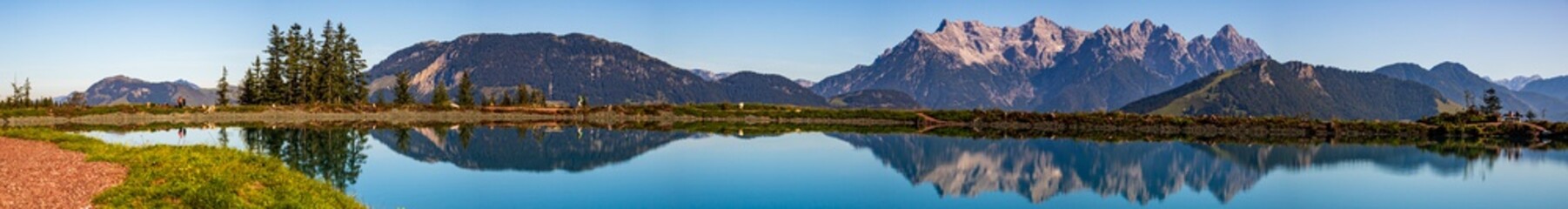 High resolution stitched panorama of a beautiful alpine view with reflections in a lake at Fieberbrunn, Tyrol, Austria