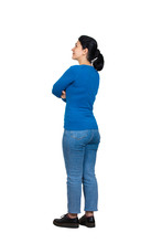 Full Length Side View Of Casual, Confident Young Woman Posing With Arms Crossed Isolated Over White Background With Copy Space. Happy Facial Expression Looking To Camera.