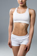 © F8  \ Suport Ukraine - Slim waist of young sporty woman. Detail of perfect fit female body