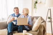 © Prostock-studio - Happy mature couple watching comedy film on laptop