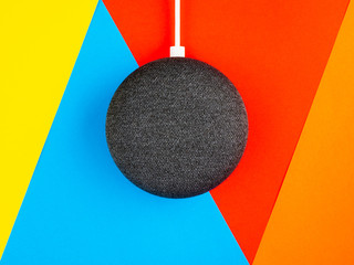 Wall Mural - Smart home device speaker on bright coloured background