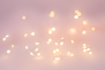 Christmas Golden lights on a light pink background