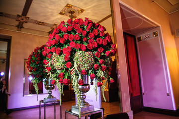 Wall Mural - catering at a top event, glasses and flowers on the table, preparation for a significant event, beautiful dishes and glasses on the table, New Year's holiday table