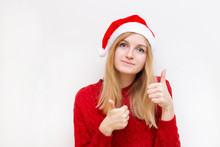 Cheerful Woman In Santa Hat Showing Thumb Up. Girl Looking At Camera And Smiling Isolated On White Background.