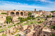 Aerial Panoramic Cityscape View Of The Roman Forum And Roman Colosseum In Rome, Italy. World Famous Landmarks In Italy During Summer Sunny Day.