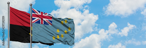 Cuadros en Lienzo Angola and Tuvalu flag waving in the wind against white cloudy blue sky together