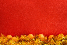 Christmas Baubles On A Red Glitter Texture Background, Merry Christmas Celebration.
