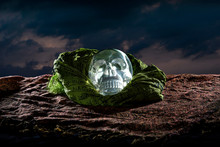 Scary Or Creepy Glowing Crystal Skull On Halloween Holiday Or Dia De Los Muertos Day Of The Dead Festival.  Depicts Horror Theme And Superstition.