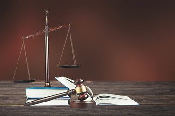 Wall Mural - Law scales on table background. Symbol of justice