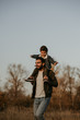 © Olena Bloshchynska - Father giving son ride on his shoulders during countryside walk.