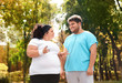 © New Africa - Overweight couple in sportswear together in park