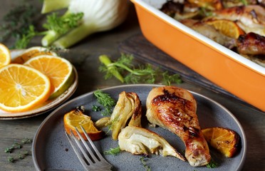 Canvas Print - dish with fennel. Baked chicken drumsticks with fennel and oranges. festive dish, popular in the Mediterranean. Keto diet dish. ceramic baking dish.