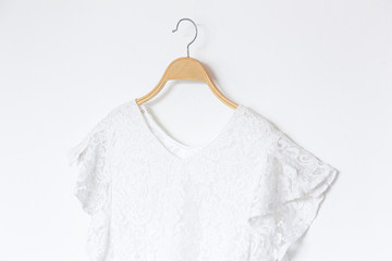 Wall Mural - White blouse is clothes hanging on white background.