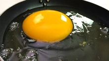 Big Ostrich Egg Cracked Open In A Pan, Top View