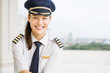 Good looking commerical pilot woman at the airport. Aviation.
