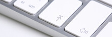 Silver Keyboard With White Key Push Button