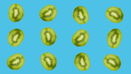 Wall Mural - Sweet kiwis is shaking on a colored background. Vegetarian theme