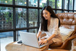 © Have a nice day  - Asian young business women working with new project modern loft,laptop in coffee shop cafe, Analyze plans, papers, hands texting keyboard.Generic design notebook,technology or startup business concept