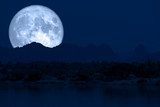 Fototapeta Natura - super full fish moon back on cloud and mountain on night sky