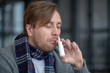 © zinkevych - Sick man taking nasal spray while cannot breathing