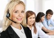 © BillionPhotos.com - Beautiful businesswoman portrait  with headset , colleagues on background